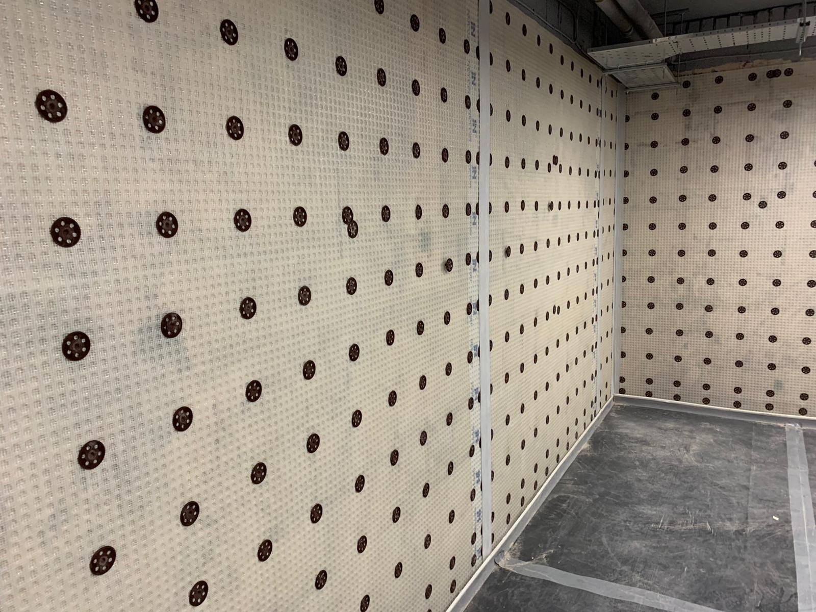 Damp proofing completed on interior wall